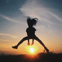 Silhouette of man against sky at sunset