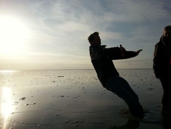 Silhouette of people on beach