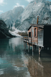 Scenic view of lake by snowcapped mountains during winter