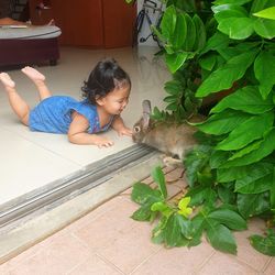 Cute baby boy on floor at home