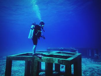 Full length of woman standing in water