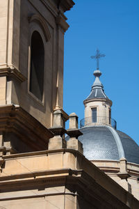 Low angle view of bell tower against sky