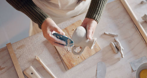 High angle view of woman sitting on table