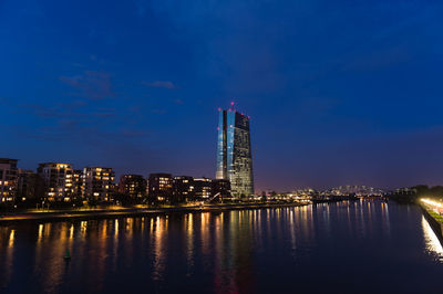 Reflection of illuminated buildings in water