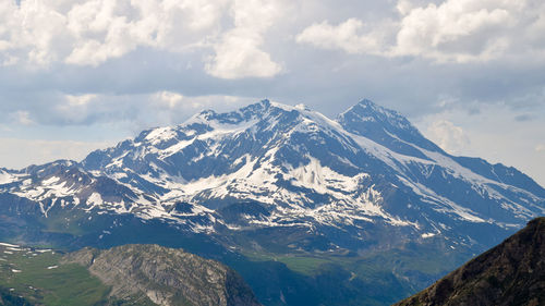 Scenic view of snowcapped mountains against sky