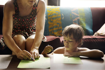 Mother and son playing indoors