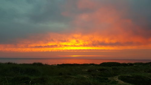 Scenic view of sea against sky during sunset