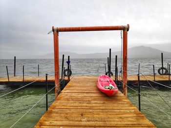 Pier over sea against sky