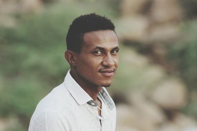 Portrait of young man standing outdoors