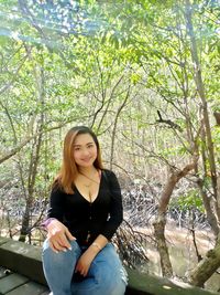 Portrait of young woman in forest