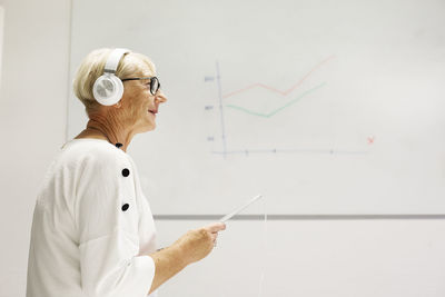 Senior woman listening music