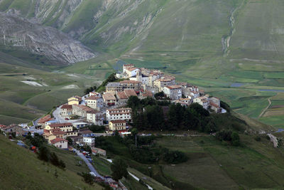 High angle view of town amidst mountains