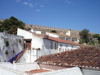 Houses against clear blue sky