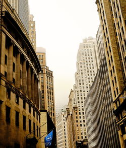 Low angle view of buildings against sky in city