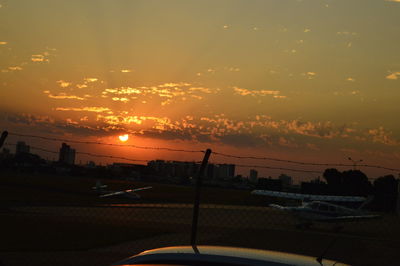 Car against sky during sunset