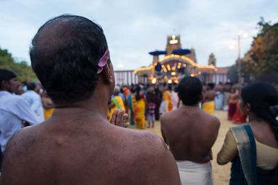 Rear view of people looking at city