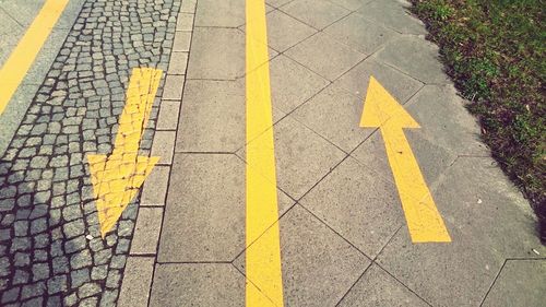 Arrow sign on road