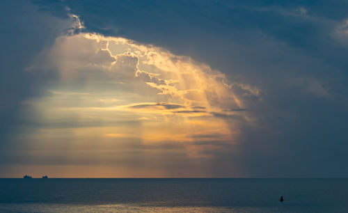 Scenic view of sea against sky during sunrise