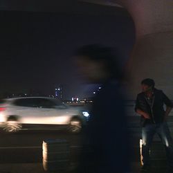 Woman standing at night