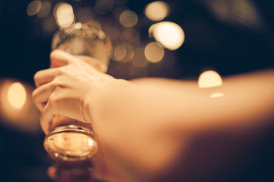 Midsection of man drinking glass