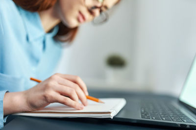 Close-up of woman using mobile phone