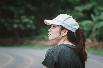 Portrait of young woman looking away