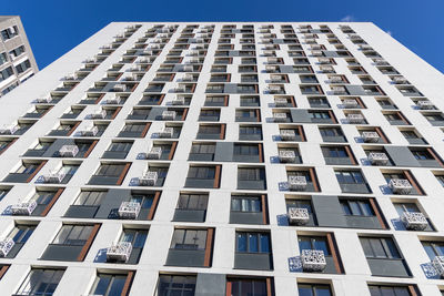 Low angle view of modern buildings against clear sky