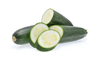 Close-up of zucchini over white background