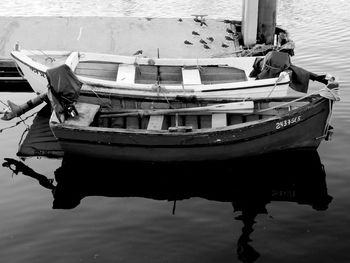 High angle view of boat moored by pier in lake