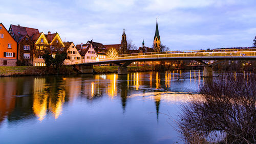 Bridge over river with buildings in background