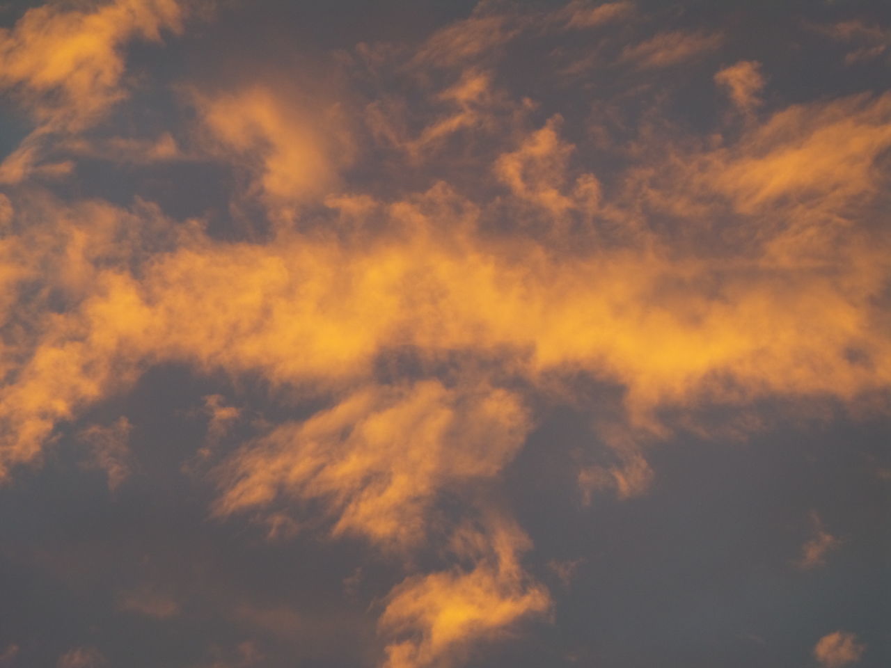 LOW ANGLE VIEW OF ORANGE CLOUDS IN SKY