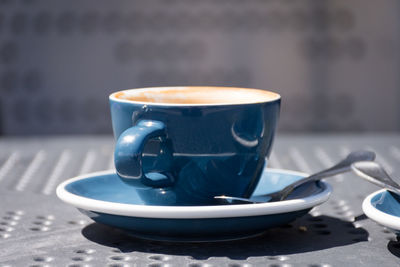 Close-up of coffee cup on table