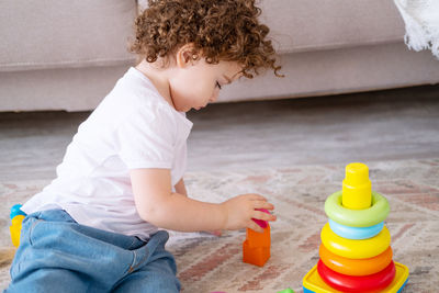 Portrait of boy playing with toy blocks