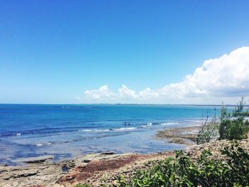 Scenic view of sea against clear blue sky