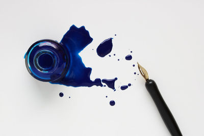 High angle view of blue and white paper on table