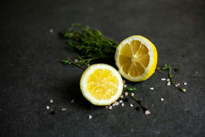 Close-up of halved lemon on table