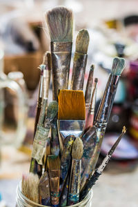 Artists paintbrushes in a glass jar 
