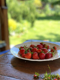 Close-up of strawberries in plate on table