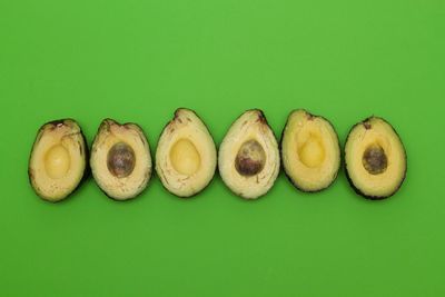 Close-up of eggs against green background