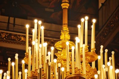 Illuminated candles in temple building