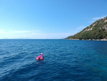 Scenic view of sea against blue sky