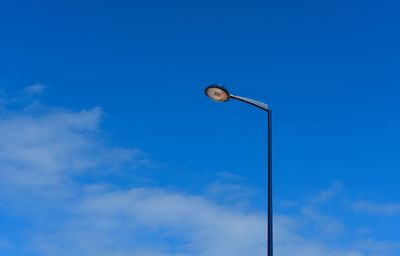 Low angle view of street light against sky