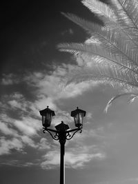 Low angle view of antique street light against sky