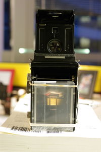 Close-up of camera on table