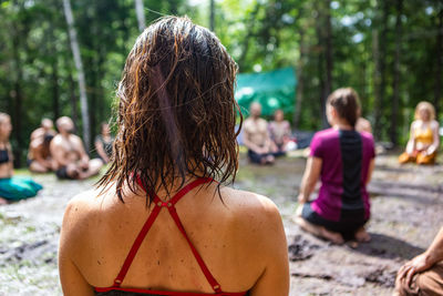 Rear view of women sitting outdoors