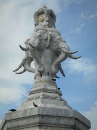 Low angle view of statue against sky