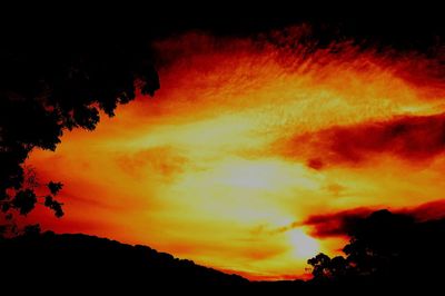 Low angle view of dramatic sky during sunset