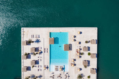 High angle view of swimming pool against building in city