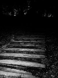 Footpath by trees in forest