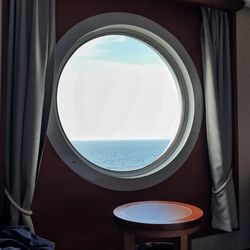 Scenic view of sea seen through airplane window